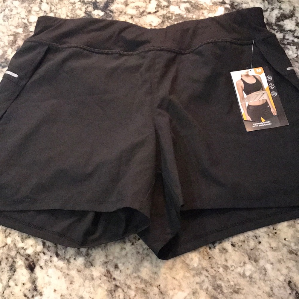Avia bike shirt with running short. Size M 8-10. Brand new with tags